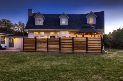 Spacious back yard with beautiful greenery and inviting entry.