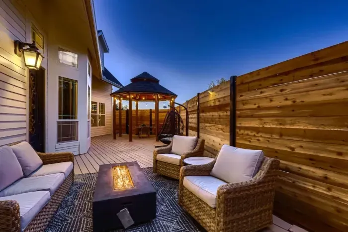 Inviting outdoor lounge with cozy fire pit, perfect for evening relaxation under the stars.