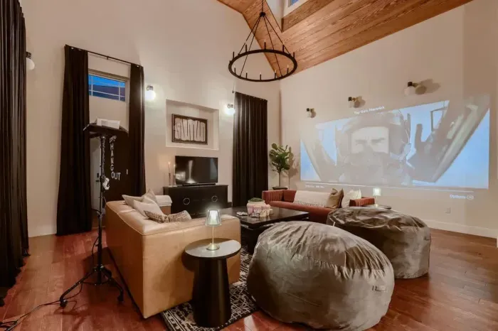 Relaxing living room with a mix of contemporary and vintage touches. Curl up and watch a movie on the projector!