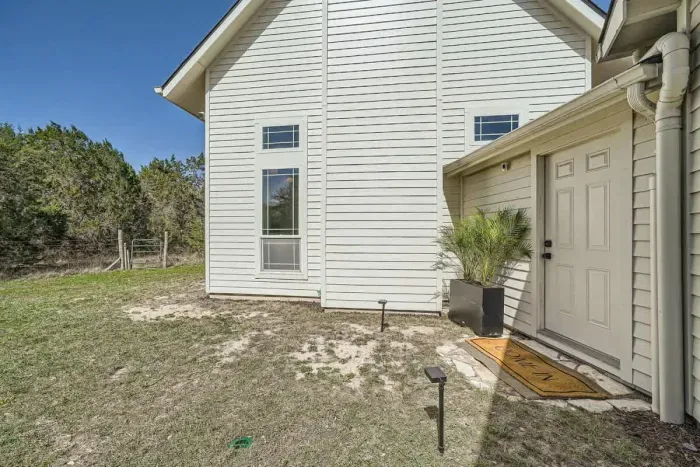Welcoming private entrance with charming farmhouse touches.