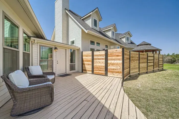 Relax on the inviting front porch, complete with a cozy swing and a perfect spot to enjoy your morning coffee.