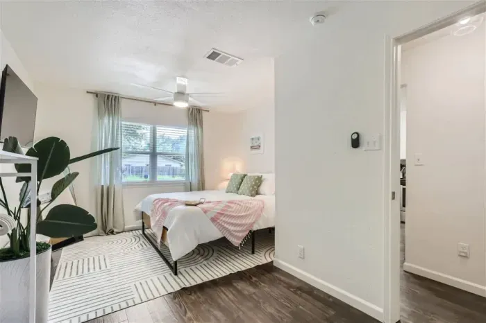 Modern bedroom with minimalist design and high-quality bedding.