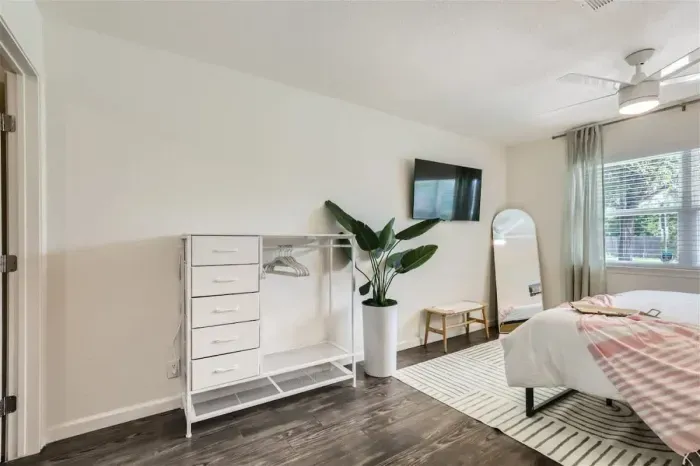 Modern bedroom with minimalist design and high-quality bedding.