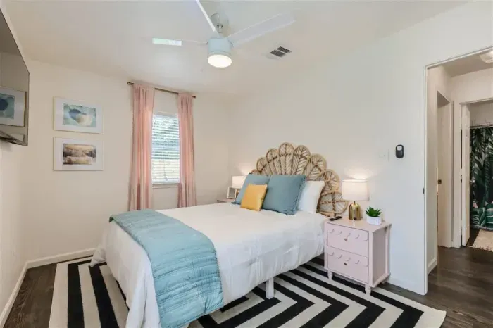 3. Romantic bedroom with elegant lighting and soft, neutral tones.