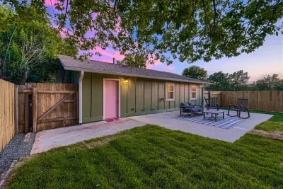 Well-maintained backyard with a variety of trees and shrubs for a natural, private setting.