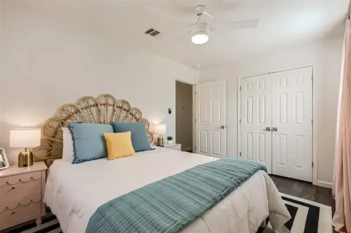Romantic bedroom with elegant lighting and soft, neutral tones.