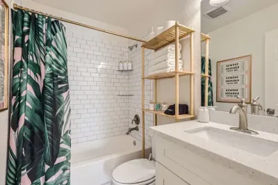 Bright bathroom with subway tile, full vanity, and fresh towels. Stocked with all your daily essentials.