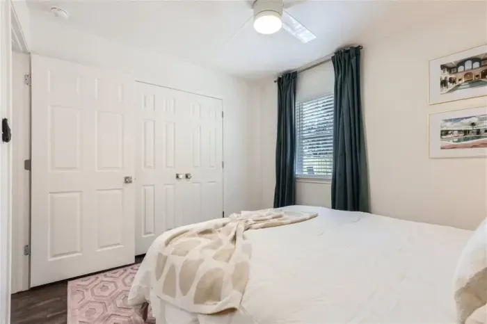 Guest-friendly bedroom with a cozy vibe and ample storage space.