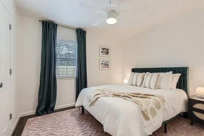 Serene bedroom with calming colors and thoughtfully chosen furnishings.