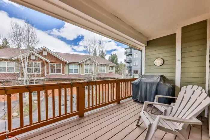 Relax on the charming porch, a cozy space perfect for enjoying the outdoors. Whether it's sipping a morning coffee or unwinding in the evening, this inviting spot offers a peaceful setting with a welcoming atmosphere.