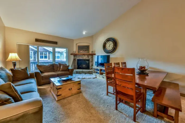 Open-concept living room with seamless flow to the kitchen and dining areas.