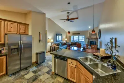 Warm and inviting kitchen with beautiful countertops and all the comforts of home.