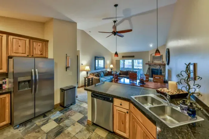 Warm and inviting kitchen with beautiful countertops and all the comforts of home.