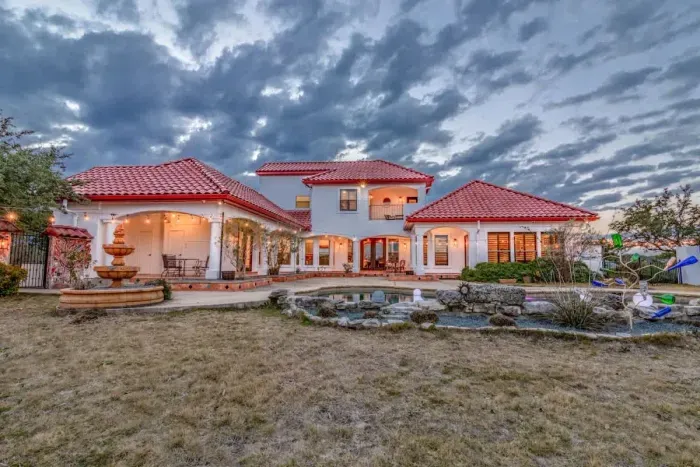 Gorgeous backyard with a sparkling pool, perfect for sunbathing and swimming.