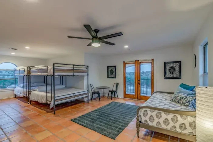 Ideal for families and groups, this bedroom offers generous sleeping arrangements.