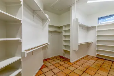 Guest-friendly bedroom with a cozy vibe and ample storage space.