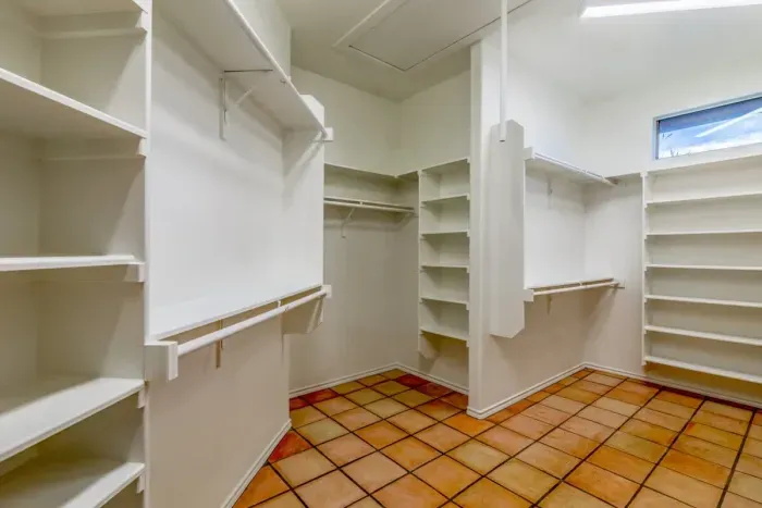 Guest-friendly bedroom with a cozy vibe and ample storage space.