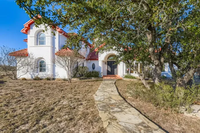 Hill Country backyard with trees.