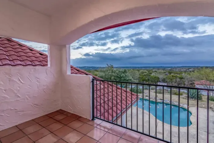 Tranquil patio with a mix of shade and sun, perfect for reading or enjoying a peaceful afternoon.