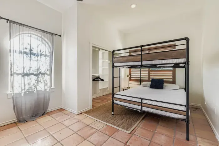 Bunk room with multiple beds.