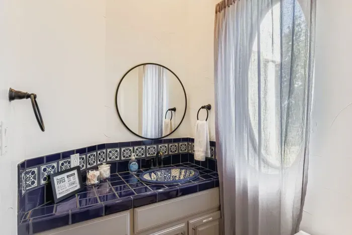 Bathroom with tiled vanity