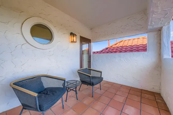 Private balcony with seating.