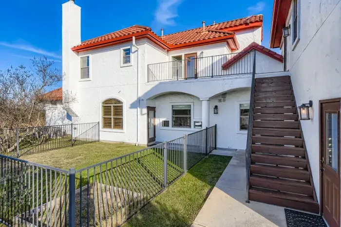 Backyard stairs and upper access.