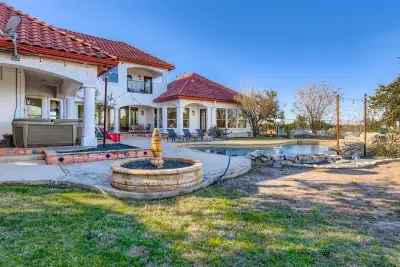 Spacious backyard with fire pit.