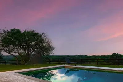 Relax by the pool as the sun sets, casting a warm, golden glow over the water. The stunning view creates a tranquil atmosphere, perfect for unwinding and enjoying the beauty of the evening.
