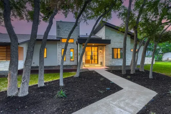 Bright and airy exterior with a mix of modern materials and natural finishes.