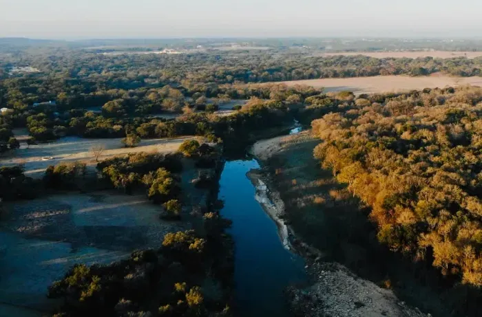 Experience the tranquility of nature with this breathtaking property featuring scenic views of rolling landscapes and a winding creek. Perfect for outdoor enthusiasts or those seeking serene living. Your dream escape awaits!