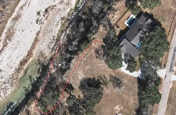 Trail to river behind house, or walk/park down the street at Camp Tejas (5 min walk)