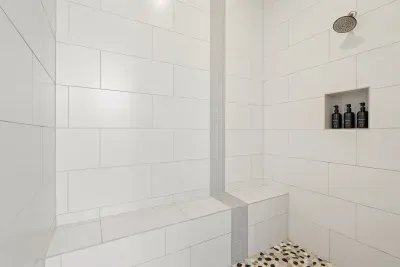 Cozy bathroom with a walk-in shower and chic, minimalist design.