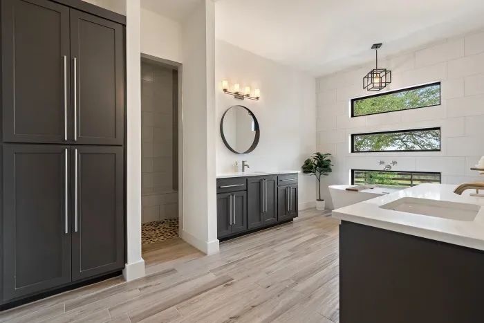 Bright and airy bathroom with plenty of counter space and stylish decor.