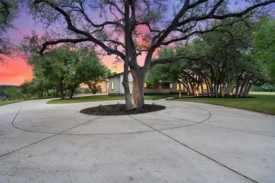 Plenty of parking space in the circle driveway, surrounded by lush greenery, the well-maintained yard offers a tranquil space to relax and enjoy nature.