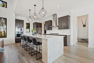 Sleek and modern design meets functionality in this fully stocked kitchen.