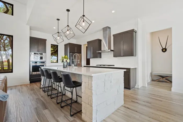 Sleek and modern design meets functionality in this fully stocked kitchen.