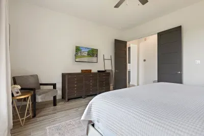 Thoughtfully designed with comfort in mind, this primary bedroom offers a seamless blend of warmth and sophistication.