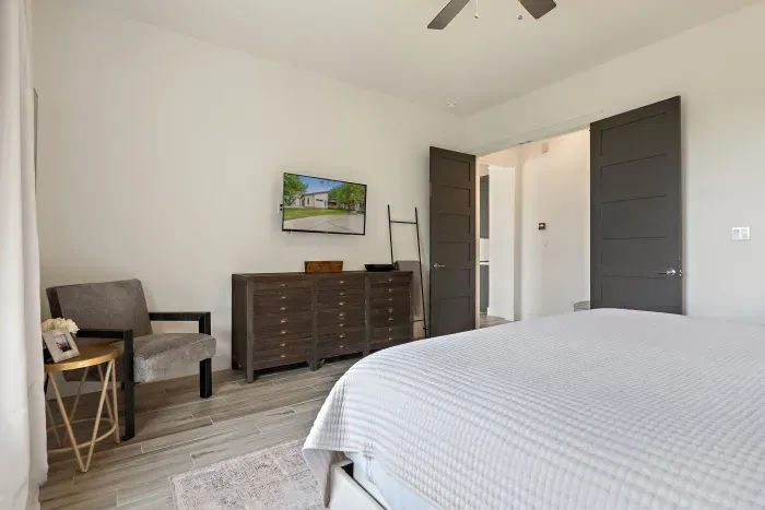 Thoughtfully designed with comfort in mind, this primary bedroom offers a seamless blend of warmth and sophistication.