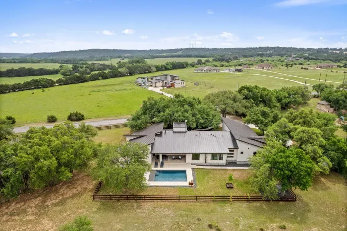 Modern Hill Country escape with panoramic views and a private pool.