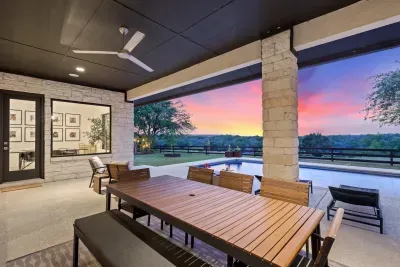 Covered patio with outdoor dining and endless Hill Country views.