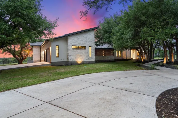 Circular driveway entrance for easy access and convenience.