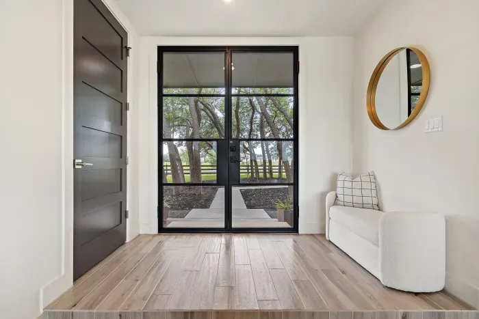 Foyer entry with natural light and clean, elegant finishes.