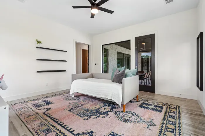 This playroom off the patio can be used as a family room, game room, or additional relaxation space. There is a daybed for you to snuggle up and enjoy a movie!