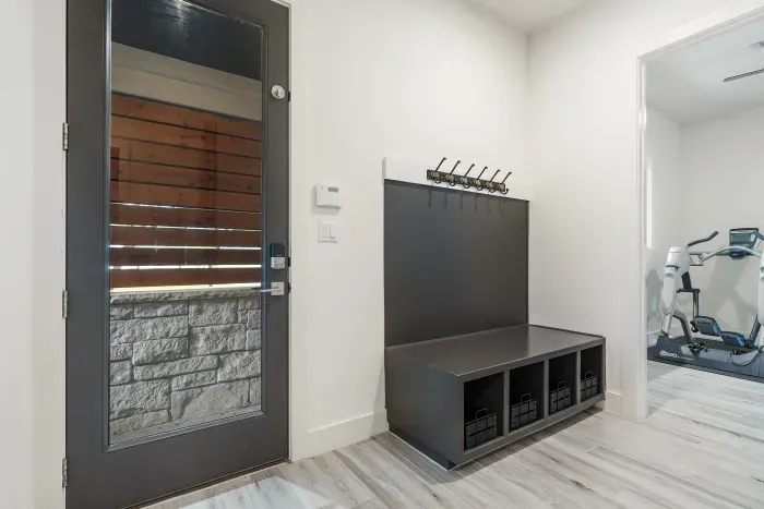 Mudroom off the breezeway entry flowing to gym, laundry area, or kitchen.