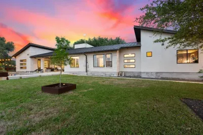 Relax by the private pool, complete with lounge chairs and shaded areas, offering a serene retreat in the backyard.