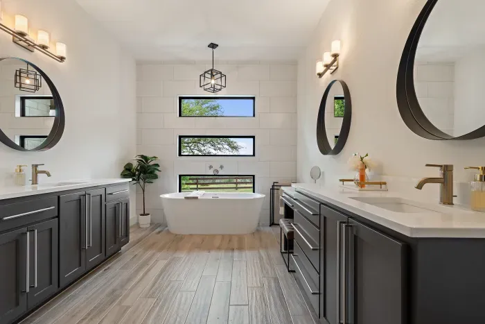 Primary bathroom with dual vanities and modern elegance.