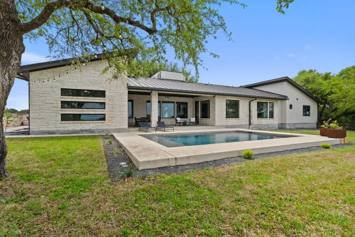 Relax and unwind by the sparkling pool, offering a perfect spot for swimming, lounging, or soaking up the sun. Surrounded by comfortable seating and beautiful landscaping, it's an ideal retreat for outdoor enjoyment.