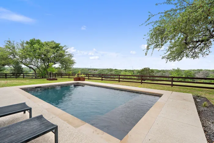 Relax and unwind by the sparkling pool, offering a perfect spot for swimming, lounging, or soaking up the sun. Surrounded by comfortable seating and beautiful landscaping, it's an ideal retreat for outdoor enjoyment.