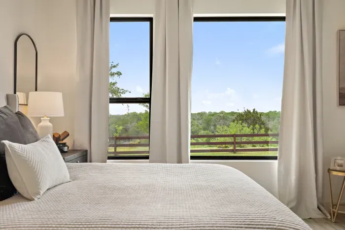 Large primary suite with huge windows and great views.